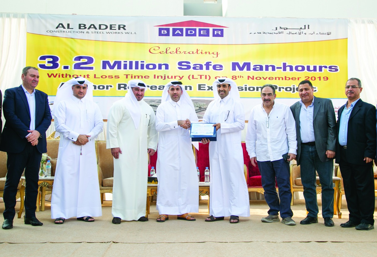 Senior officials of Barwa Real Estate Group and Al Bader Construction and Steel Works pose for a group picture after marking the safety accomplishment. 