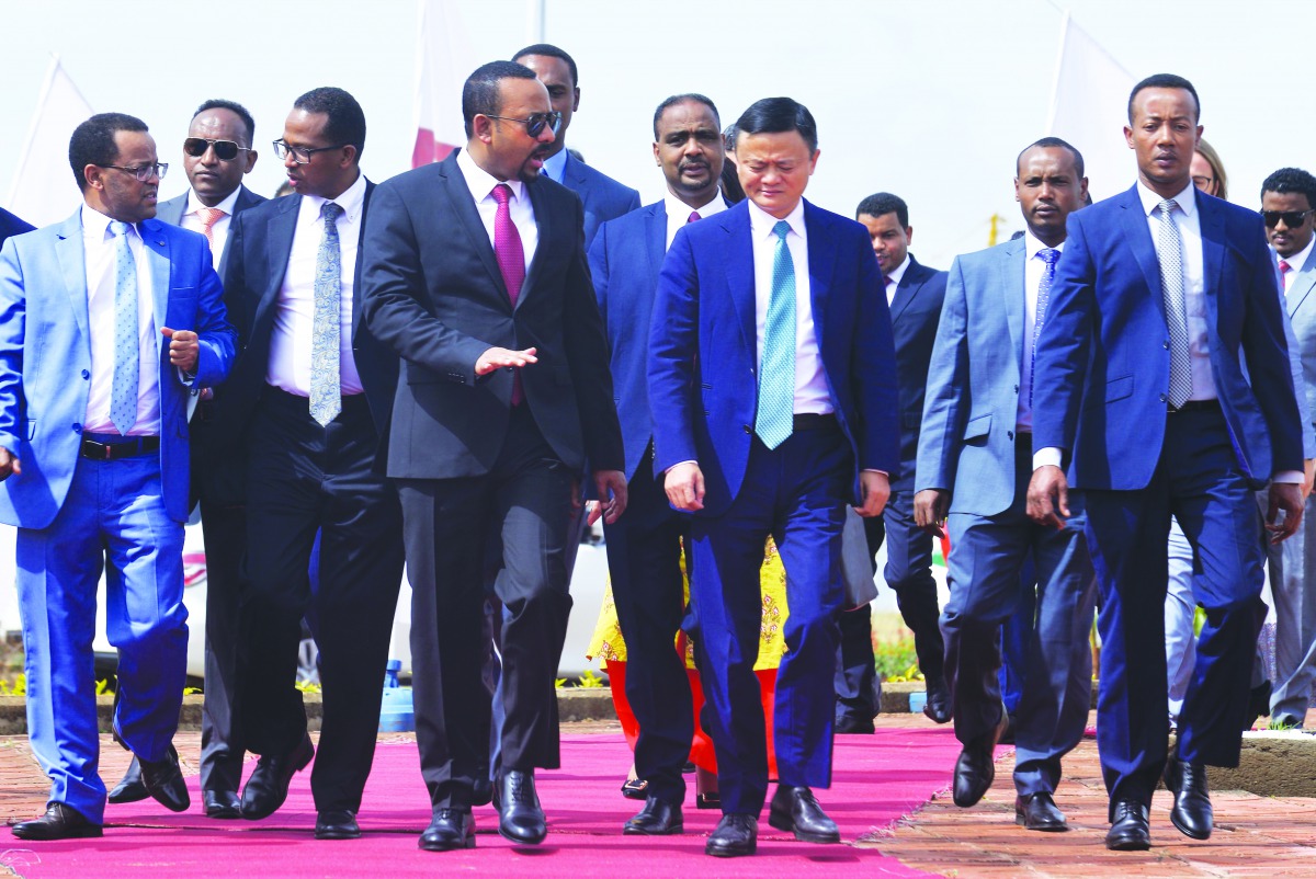 Ethiopian prime minister Abiy Ahmed (C,L) and Jack Ma (C,R), co-founder and former executive chair of Chinese Alibaba Group, attend the ceremony to sign a memorandum to establish the electronic world trade platform (eWTP) in Addis Ababa, on November 25, 2