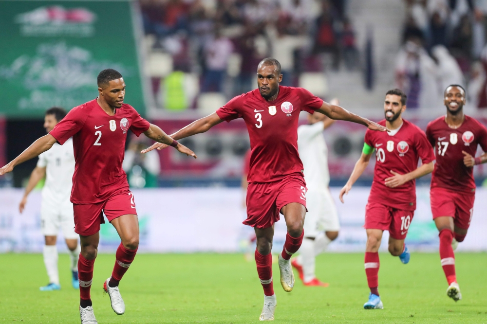 Qatar's defender Abdelkarim Hassan (C) celebrates after scoring during the 24th Arabian Gulf Cup Group A football match between Yemen and Qatar at the Khalifa International Stadium in the Qatari capital Doha on November 29, 2019. AFP / Karim Jaafar
 