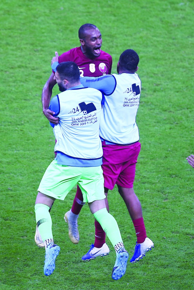Qatar’s Abdelkarim Hassan with team-mates.