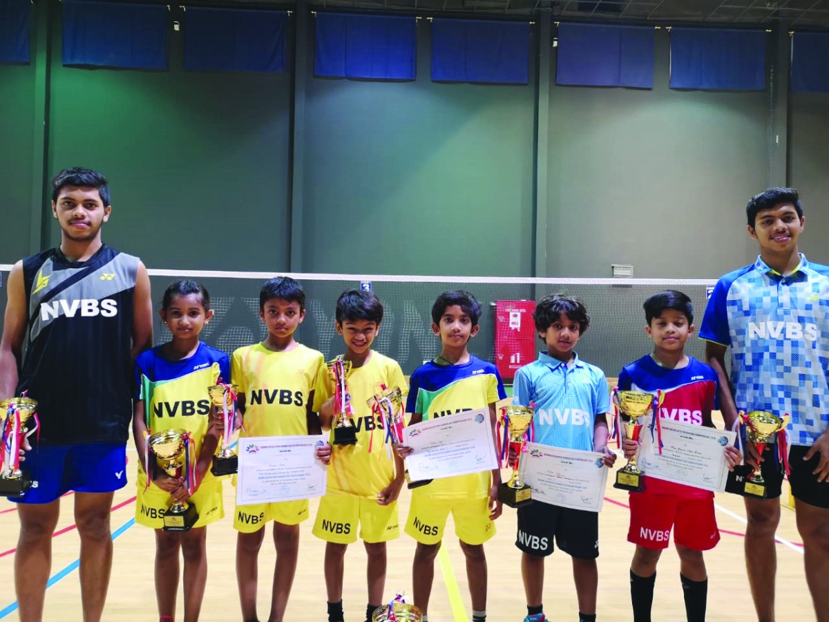 The players of New Vision Badminton Sport (NVBS) pose for a picture with coaches during the  2nd Qatar Oruma Open Badminton Championship 2019 at Ali Bin Hamad Al Attiyah Arena.