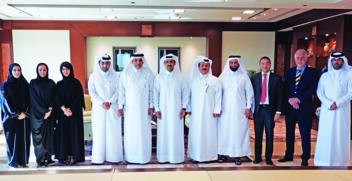 H E Saad Sherida Al Kaabi (centre), Minister of State for Energy Affairs and the President and CEO of Qatar Petroleum, with Fahad bin Hamad Al Muhannadi (fifth left), Chairman of the Board of Directors of Nebras Power, and other officials during the event