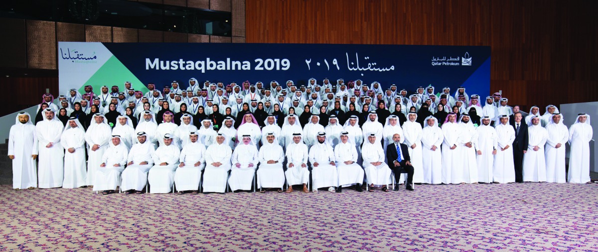 Minister of State for Energy Affairs, and Qatar Petroleum President and CEO H E Saad Sherida Al Kaabi (sixth right, front), with other QP officials and employees at the ceremony in Doha recently.