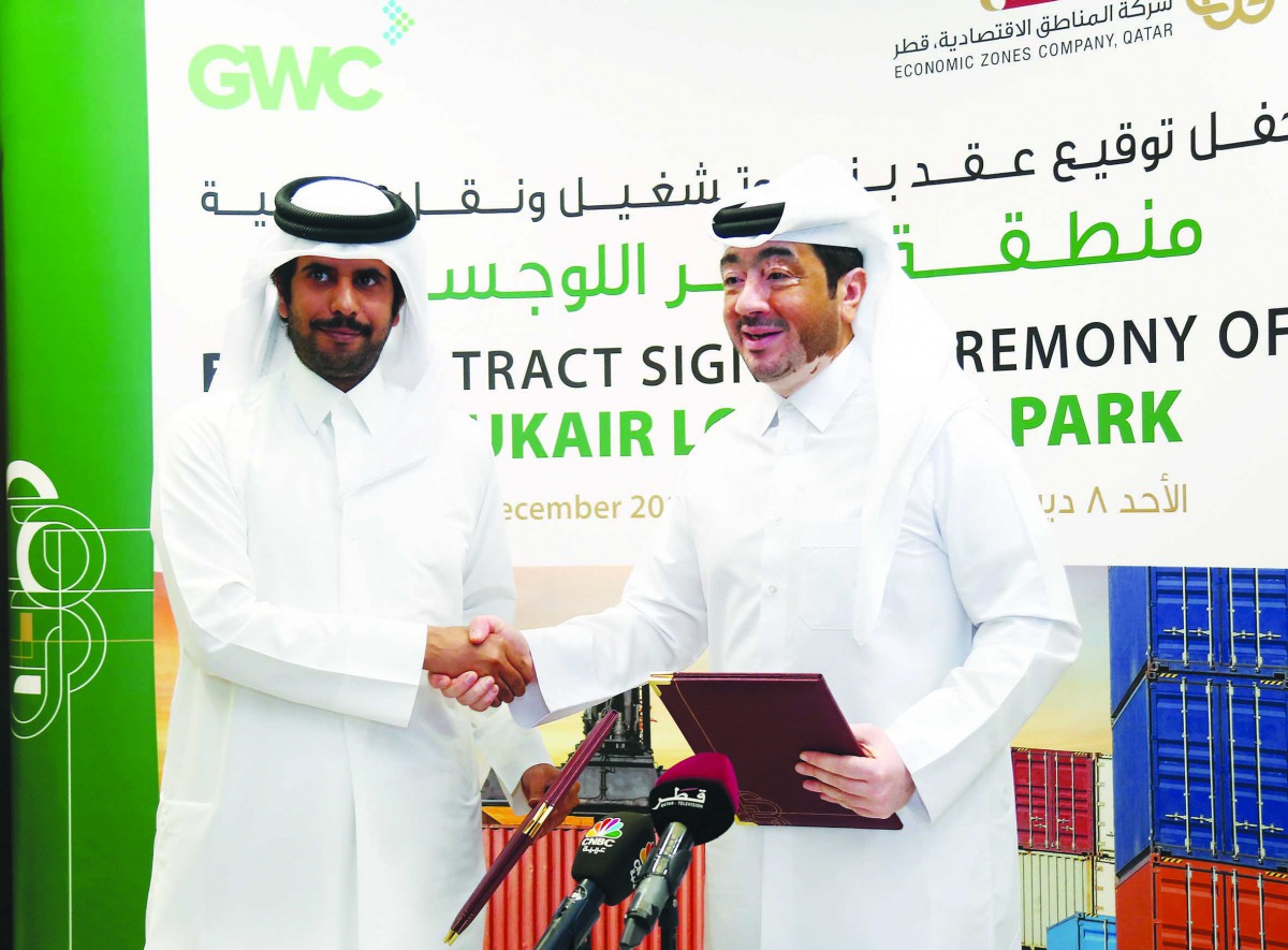Fahad Rashid Al Kaabi (right), CEO of Manateq, shaking hands with Sheikh Abdulla bin Fahad bin Jassem bin Jabor Al Thani, Chairman of GWC, during the signing ceremony at Manateq head office in Doha yesterday. Pic: Abdul Basit/the peninsula