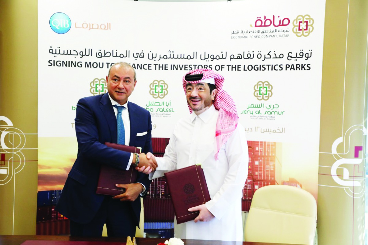 Fahad Rashid Al Kaabi (right), Chief Executive Officer of Manateq, and Bassel Gamal, QIB’s Group CEO, during the signing ceremony.