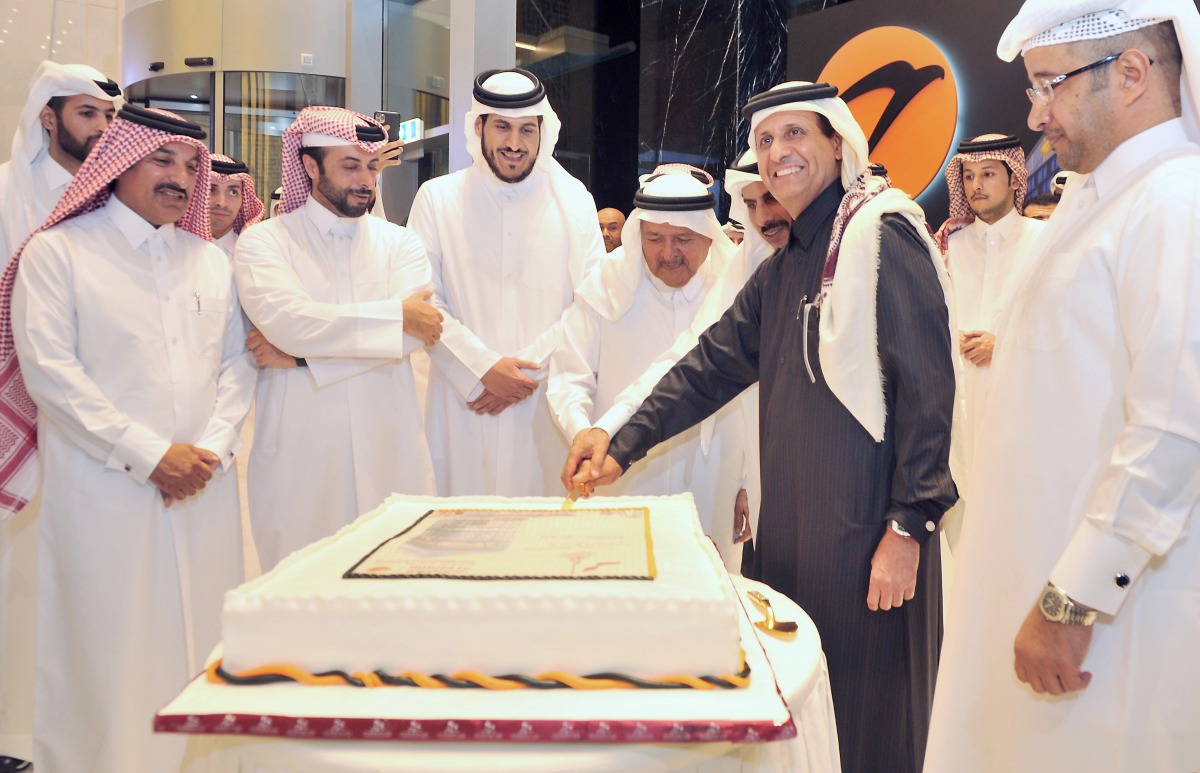 Qatar Central Bank Governor H E Sheikh Abdulla bin Saoud Al Thani joins al khaliji Chairman and Managing Director, Sheikh Hamad bin Faisal bin Thani Al Thani; Sheikh Faisal bin Qassim Al Thani; and other officials for cutting a cake to mark the formal ope