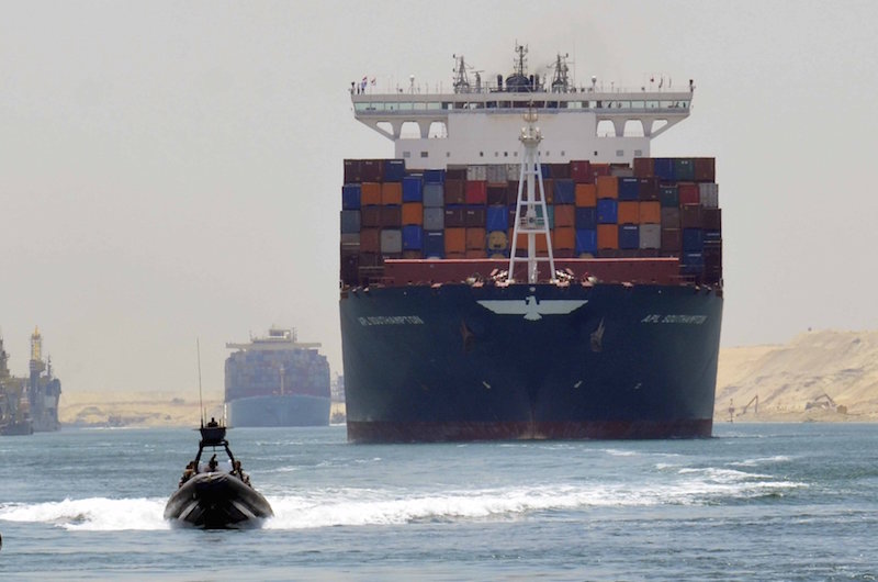 A cargo ship is seen crossing through the New Suez Canal, Ismailia, Egypt, July 25, 2015. Reuters