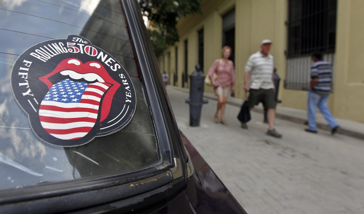 A car with a sticker of The Rolling Stones in the streets of Havana, Cuba, March 18,  2016.  EPA / Ernesto Mastrascusa