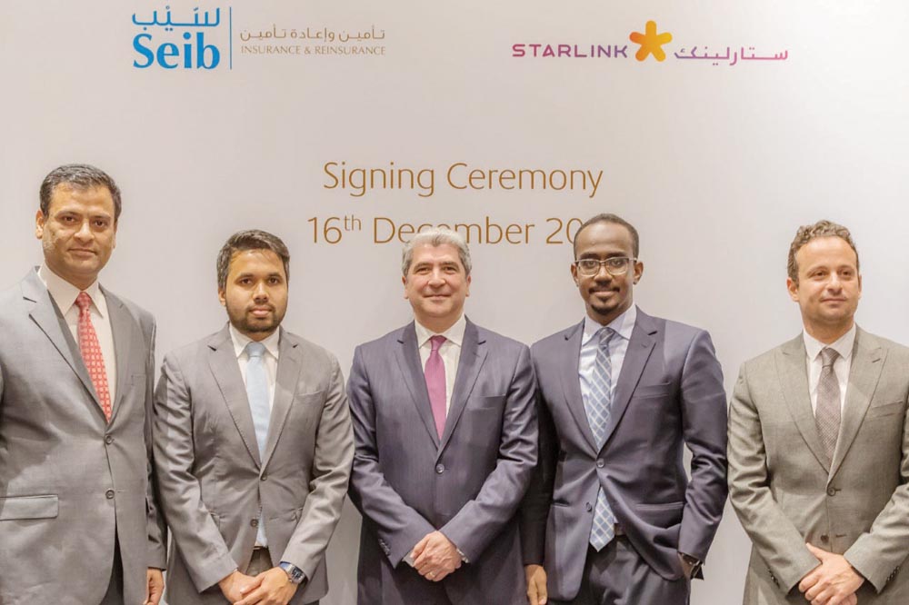 The Seib Insurance and Reinsurance Company and Starlink Qatar officials during the signing ceremony.