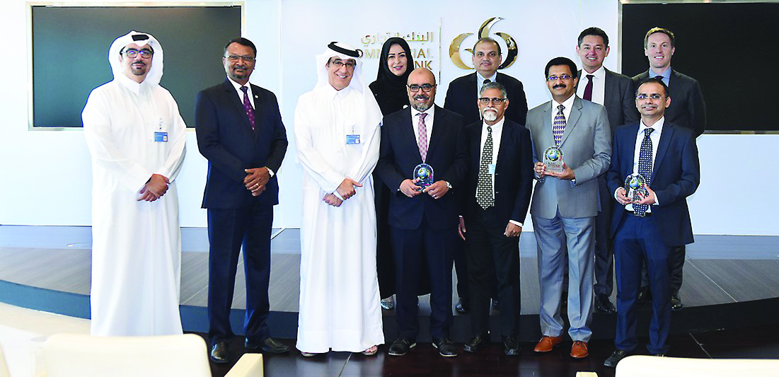 Commercial Bank’s  ‘digital leadership’, along with other senior officials posing for a group picture, after receiving the awards.
