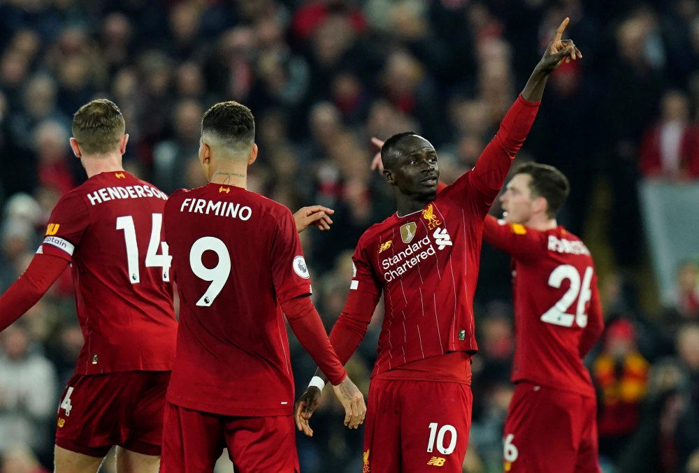 Liverpool's Sadio Mane celebrates scoring their first goal REUTERS/Andrew Yates
