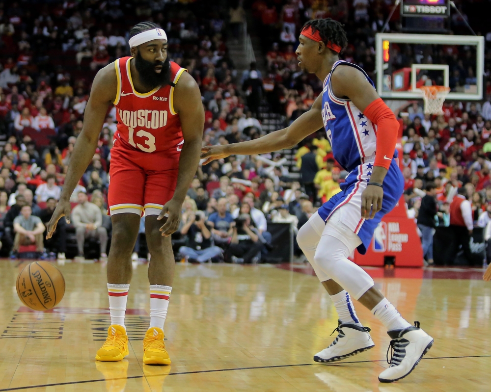 Houston Rockets guard James Harden (13) handles the ball against Philadelphia 76ers guard Josh Richardson (0) during the first quarter at Toyota Center. Mandatory Credit: Erik Williams-USA TODAY Sports