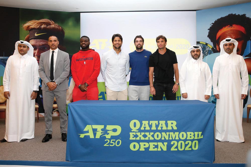 Frances Tiafoe (third left) of USA, Spaniards Fernando Verdasco (fourth left) and Pablo Andujar (fourth right), Malek Jaziri (third right) of Tunisia, players taking part in the Qatar ExxonMobil Open, pose for a picture with Tariq Zainal (second right), S