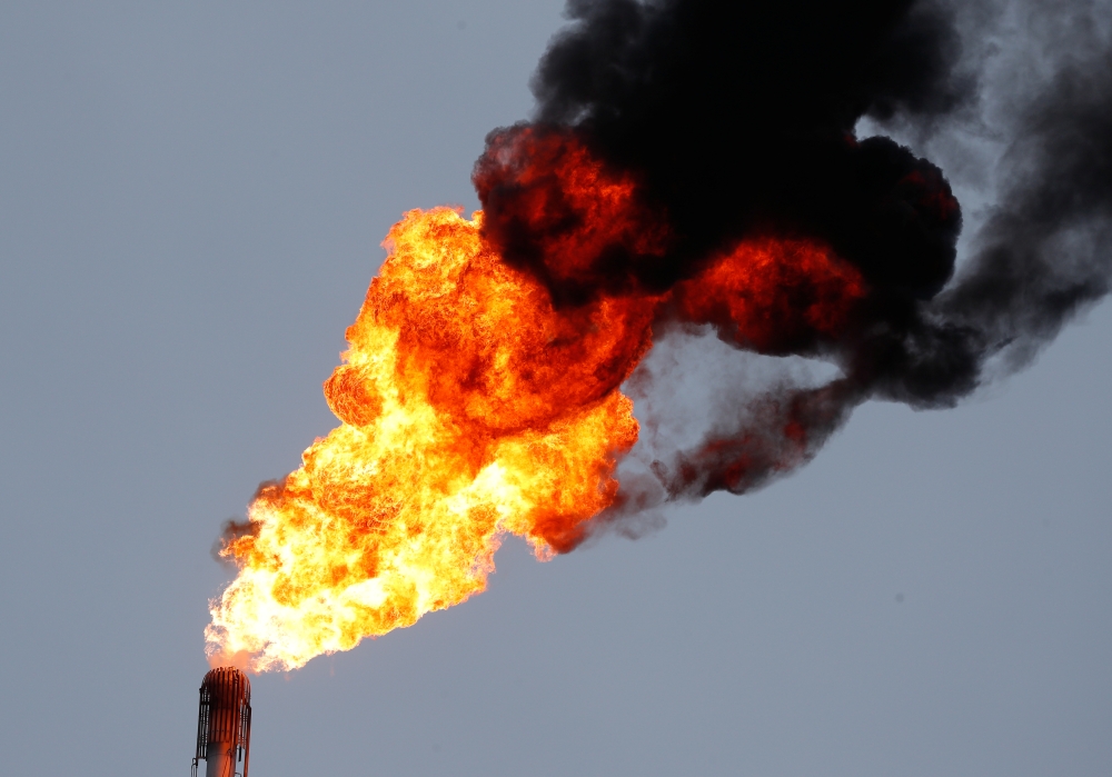 A flame burning natural gas is seen at the Joint stock company 