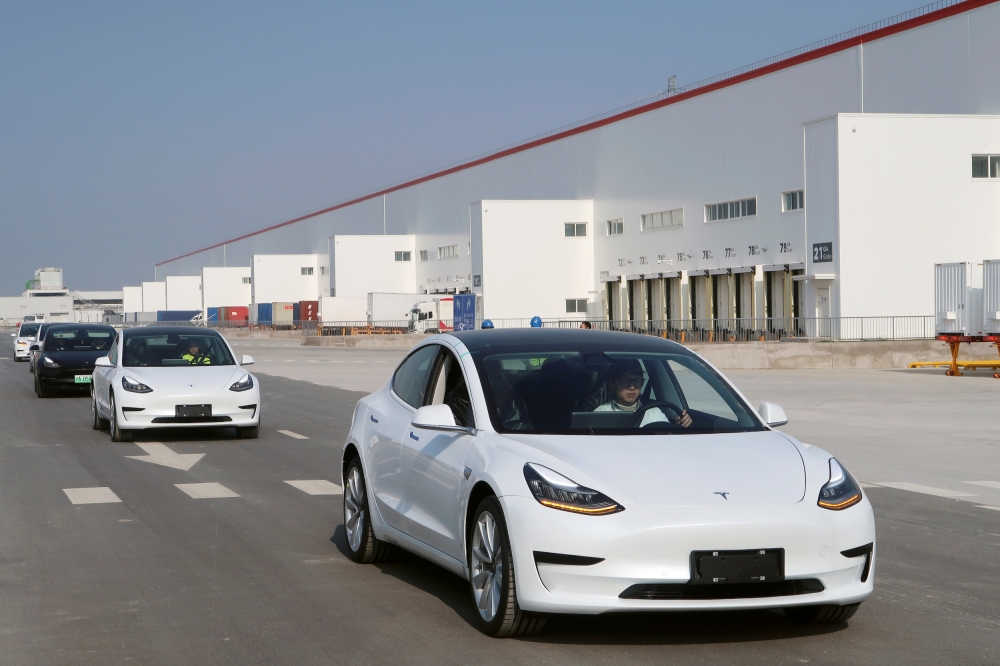 China-made Tesla Model 3 vehicles are seen at the Shanghai Gigafactory of the U.S. electric car maker in Shanghai, China December 30, 2019. REUTERS/Yilei Sun - RC2I5E9LQORA/File Photo