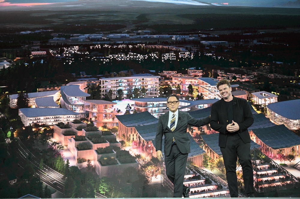 Toyota President and CEO Akio Toyoda (L) and Danish architect Bjarke Ingel reveal plans to build a prototype 