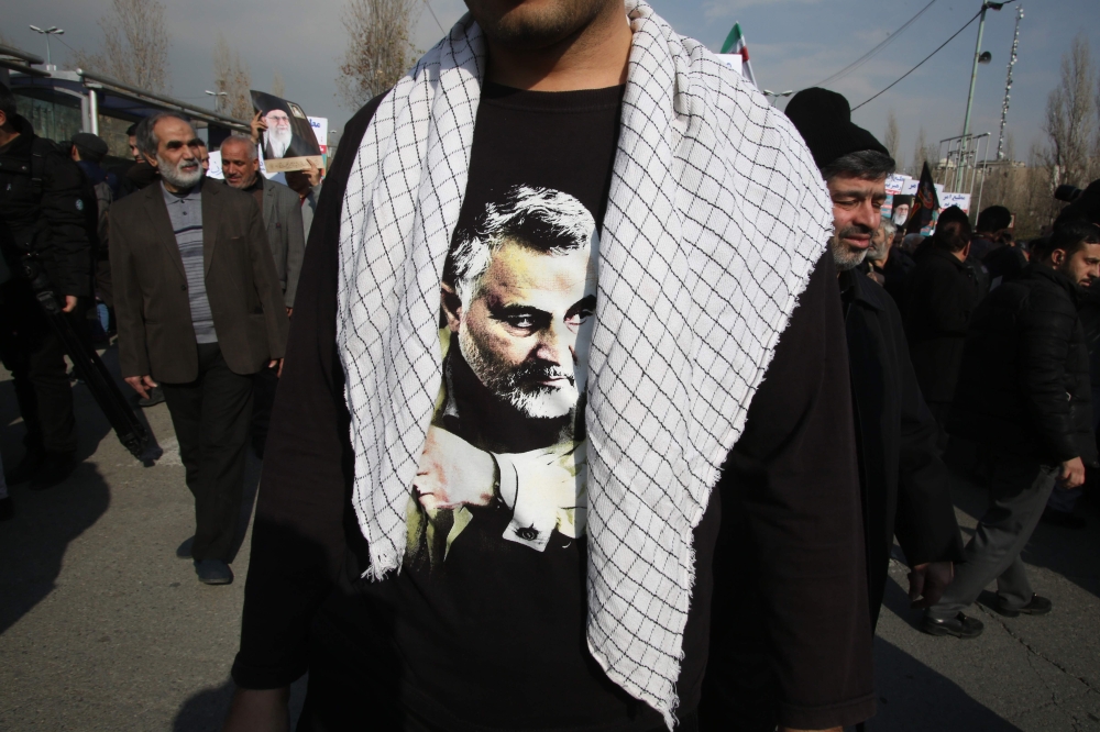 An Iranian, wearing a t-shirt with a picture of slain commander Qasem Soleimani, takes part in a demonstration in Tehran on January 3, 2020. AFP / Atta Kenare