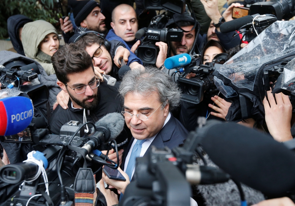 The lawyer of former Nissan chairman Carlos Ghosn speaks to the media after Ghosn's questioning, outside the Justice Palace in Beirut, Lebanon, January 9, 2020. (REUTERS/Mohamed Azakir)