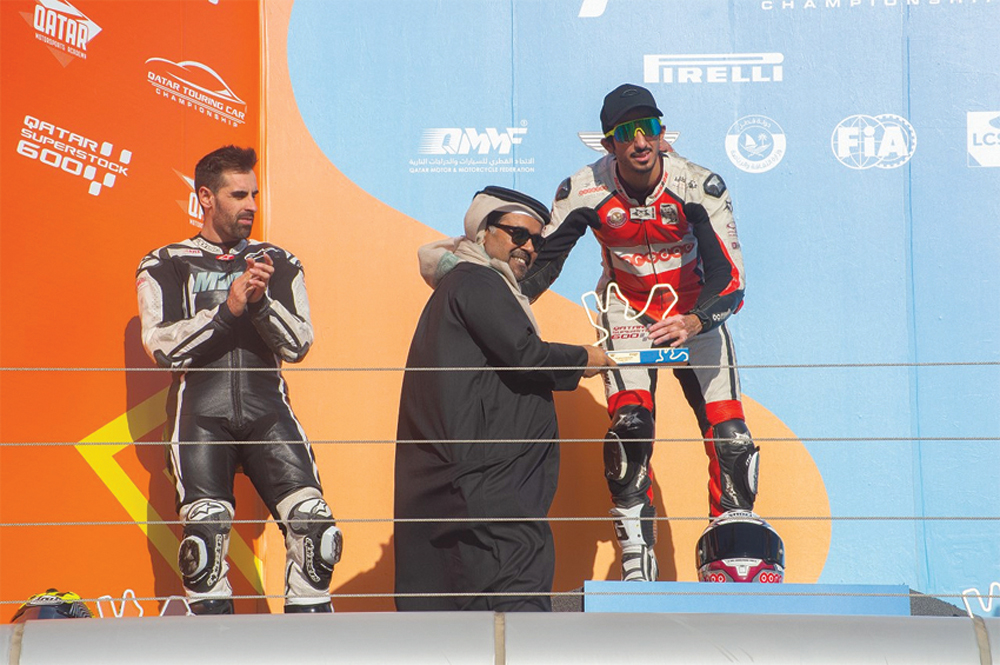 Mashel Al Naimi, receiving the winner's trophy from Abdulrahman Al Mannai, Qatar Motor and Motorcycle Federation (QMMF) President, during the Second Round of the Qatar Superstock 600 at Losail International Circuit this weekend. 