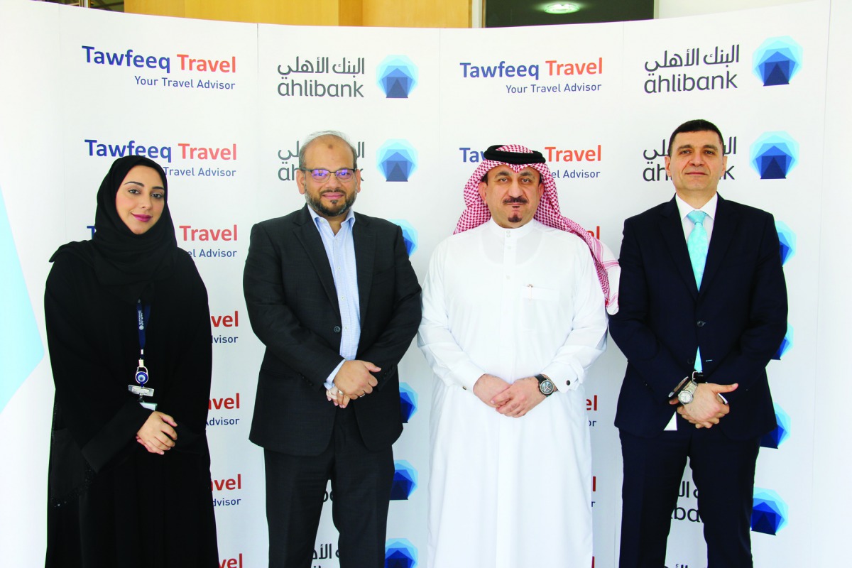 The officials of Ahlibank and Tawfeeq Travel during the event.