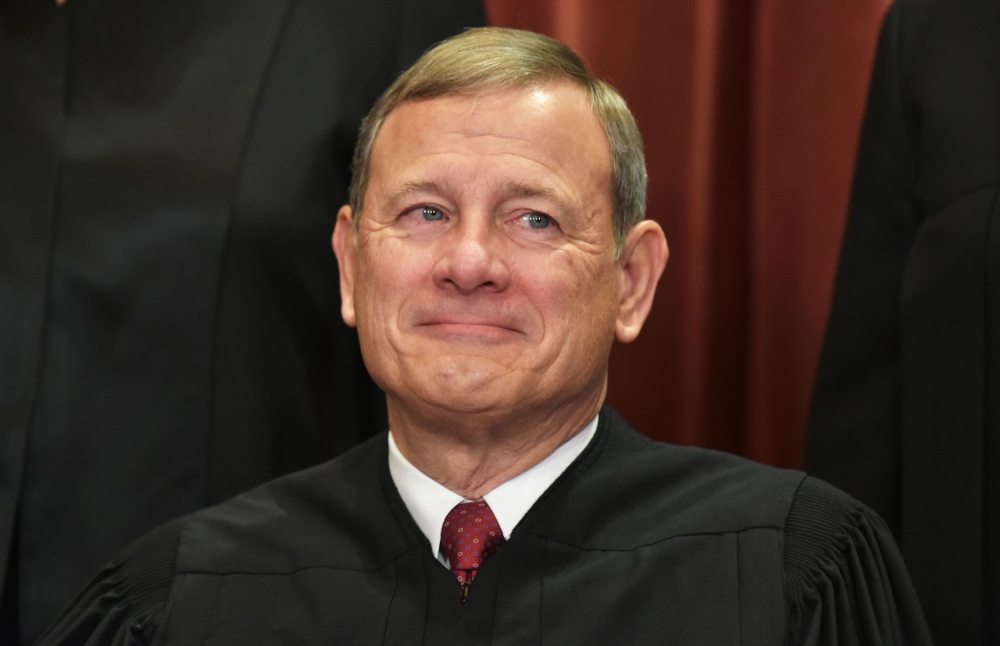 In this file photo taken on November 30, 2018 Chief Justice John Roberts poses for the official group photo at the US Supreme Court in Washington, DC.  AFP / Mandel Ngan
