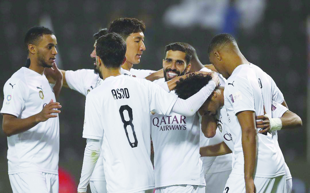 Al Sadd players celebrate their QNB Stars League win over Al Shahania on Saturday in Doha.