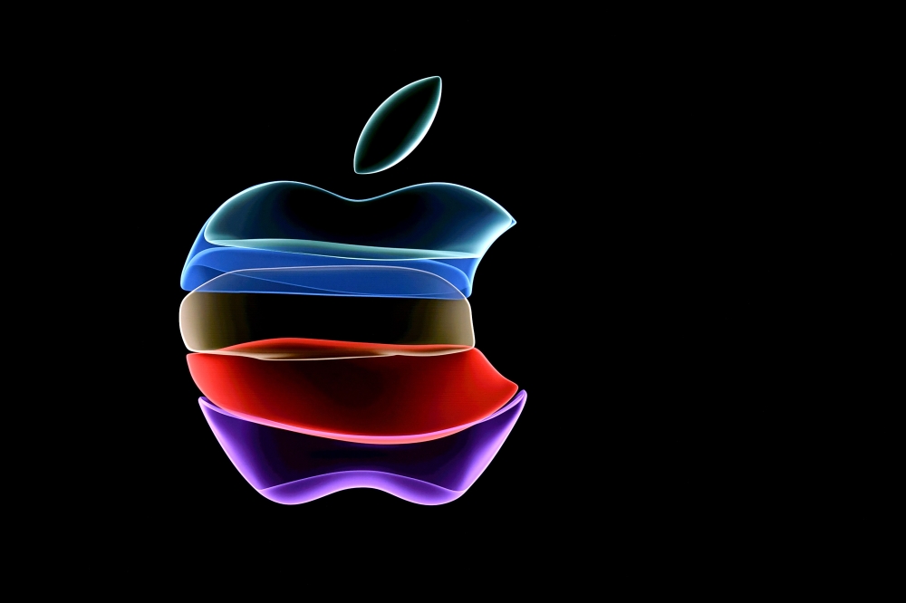 In this file photo taken on September 10, 2019 the apple logo is projected on a screen before the start of a product launch event at apple's headquarters in Cupertino, California. / AFP / Josh Edelson
