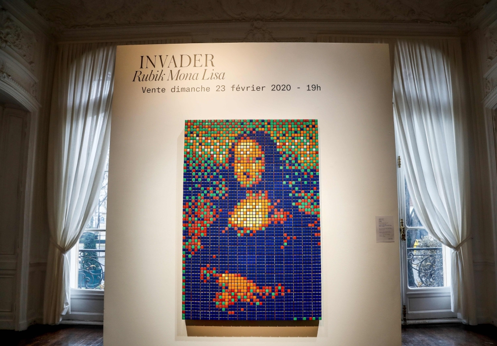 The street art Rubik's Cube version of the “Mona Lisa” entitled “Rubik Mona Lisa” made in 2005 by French artist Invader is on display at the Artcurial auction house in Paris on February 3, 2020 before being auctioned next February 23rd. AFP / Francois Gui
