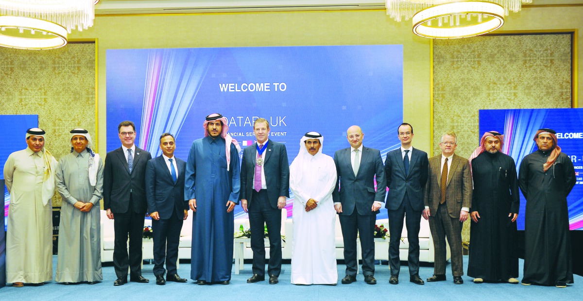 Qatar Central Bank Governor, H E Sheikh Abdullah bin Saoud Al Thani (sixth right); The Lord Mayor of the City of London, Alderman William Russell (sixth left);  Ajay Sharma, the Ambassador of the United Kingdom to Qatar (fourth left) and other officials d