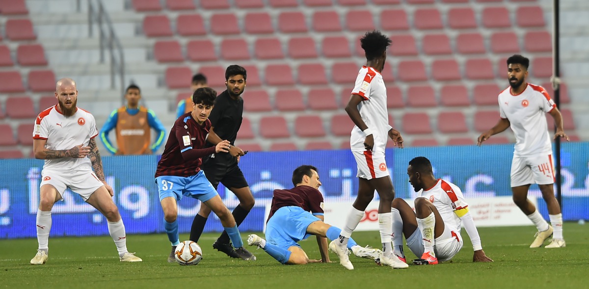 Al Arabi and Al Wakrah players in action during yesterday's opening quarter-final match of the Ooredoo Cup at the Al Arabi Stadium yesterday. Picture: Anvar Sadath