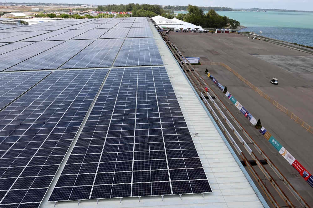 This photograph taken on February 13, 2020 shows solar panels on the roof of the Changi Exhibition centre, where the Singapore Airshow is being held, in Singapore. AFP / Roslan RAHMAN 