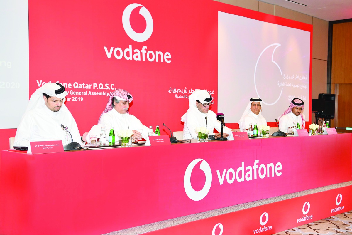 Vodafone Qatar’s Chairman Abdulla bin Nasser Al Misnad (centre), board members and Vodafone Qatar CEO, Sheikh Hamad Abdulla Jassim Al Thani (left), during the Ordinary General Assembly Meeting, yesterday. 
