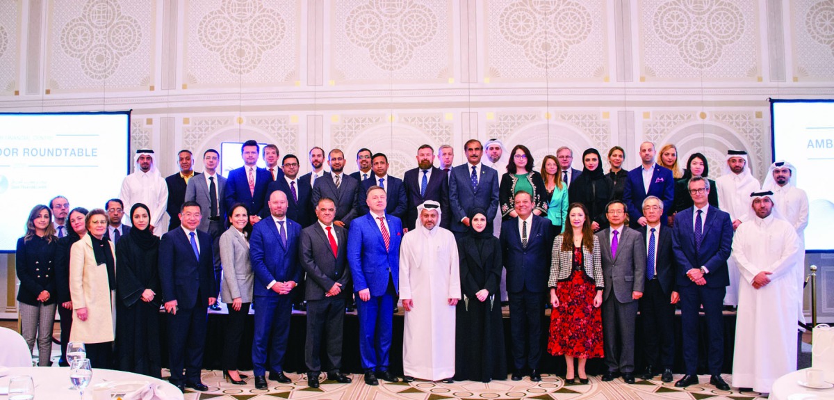 Yousuf Mohamed Al Jaida (centre), CEO, QFC Authority, and other senior QFC officials, posing for a group picture with ambassadors and senior diplomats from several countries, after the at ‘Ambassador Roundtable’ meeting, yesterday. 