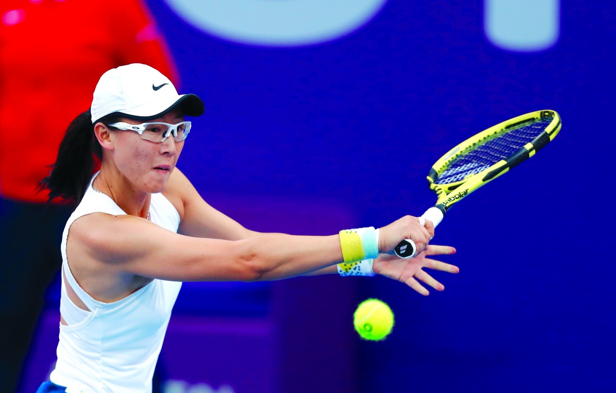 China's Saisai Zheng returns the ball to Kiki Bertens of The Netherlands at the Khalifa International Tennis Complex, yesterday.