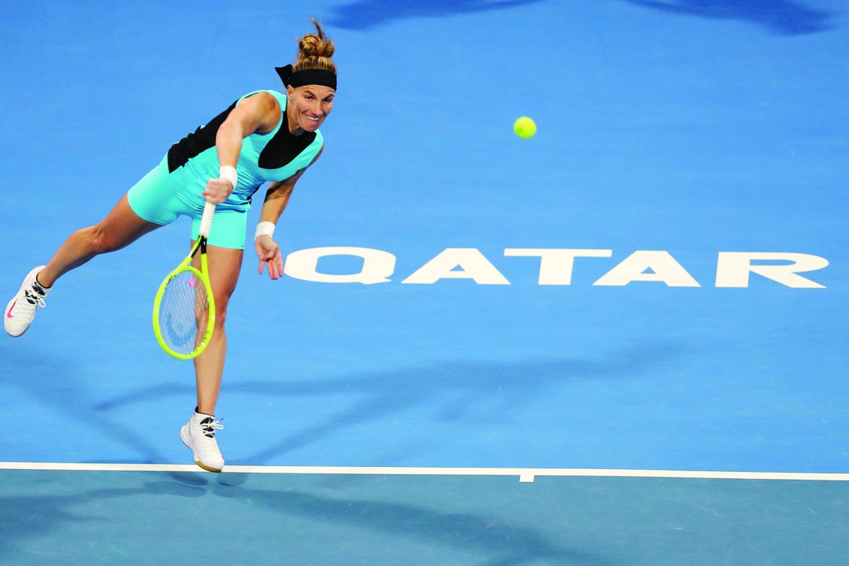 Svetlana Kuznetsova of Russia returns the ball to Belinda Bencic of Switzerland during their quarter-final match of the Qatar Total Open, yesterday.