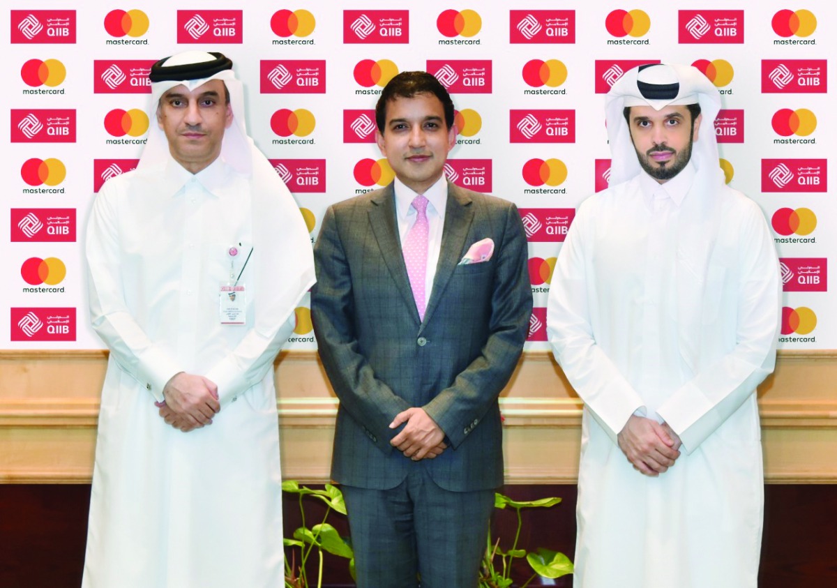 FROM LEFT: Jamal Abdullah Al Jamal (left), Deputy CEO, QIIB; Somu Roy, General Manager, Qatar, Kuwait and Iraq, Mastercard; and Omar Abdulaziz Al-Meer, Chief of Business Development, QIIB during the formal announcement of the launch of the QIIB Points Por