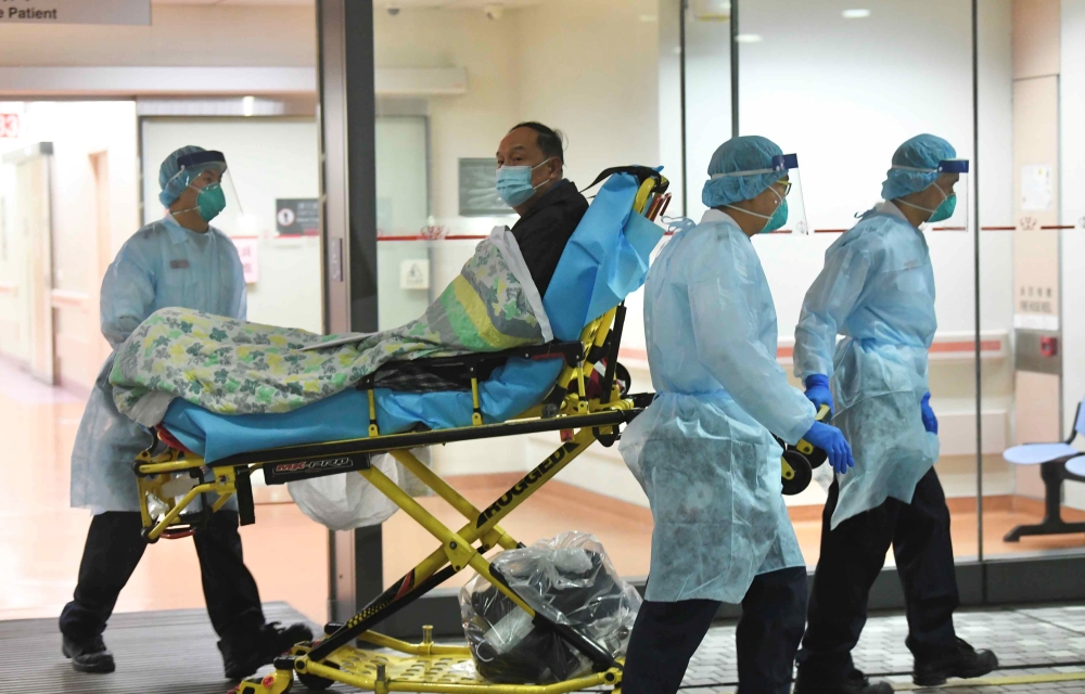 Medical staff transfer a patient of a suspected case of a new coronavirus at the Prince of Wales Hospital in Hong Kong, China, January 22, 2020. cnsphoto via Reuters