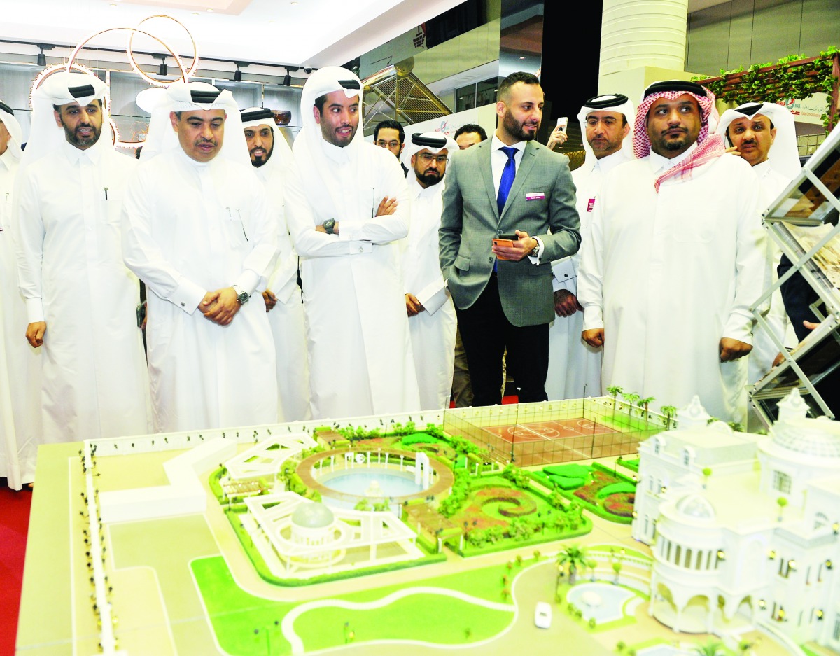 H E Ali bin Ahmed Al Kuwari (second left), Minister of Commerce and Industry, with Abdulaziz bin Nasser Al Khalifa (left), the CEO of Qatar Development Bank, and other officials during the tour after the opening of ‘Build Your House 2020 Exhibition’ at QN