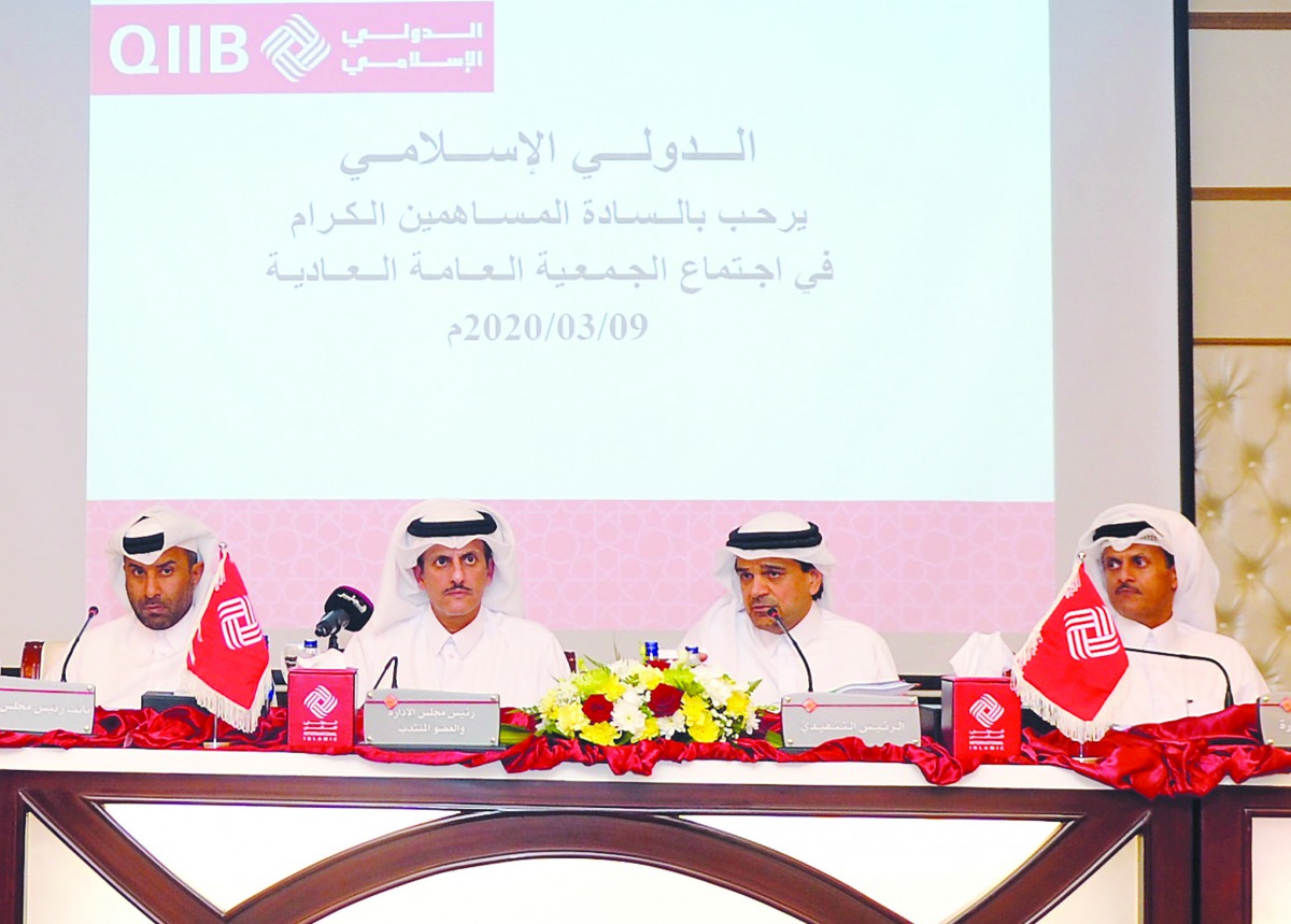 Sheikh Dr. Khalid bin Thani bin Abdullah Al Thani (second left), QIIB Chairman and Managing Director;  Rashid Nasser Al Kaabi (left), 	QIIB Vice-Chairman; Sheikh Abdullah bin Thani bin Abdullah Al Thani (right) Board Member, QIIB; and Dr. Abdul Basit Al S