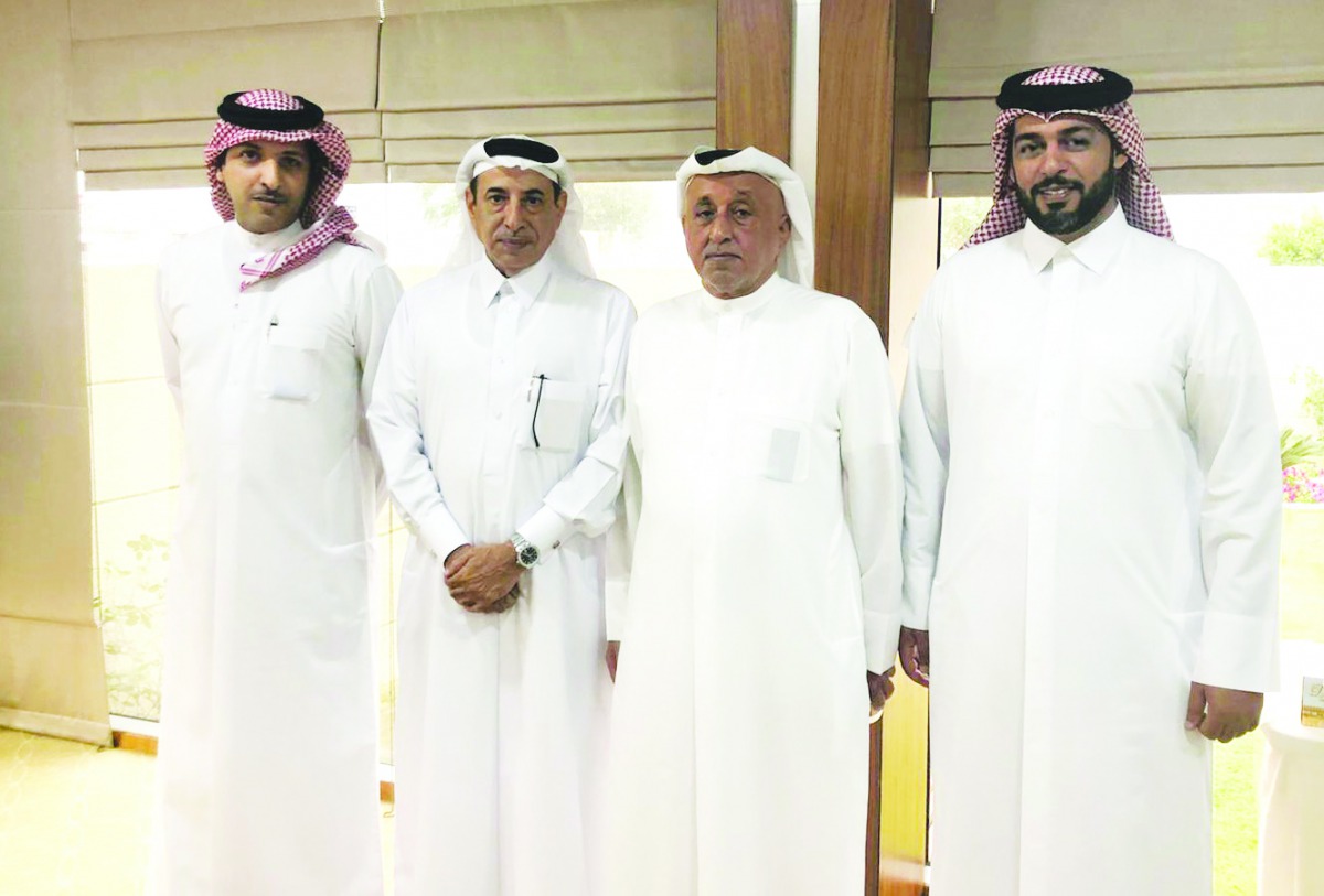 QIC Group President Khalifa Abdulla Turki Al Subaie (second right); Ali Al Fadala (second left) and other officials during the farewell ceremony.