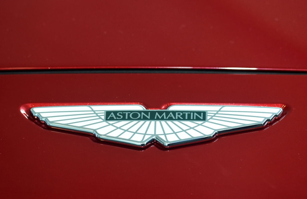 FILE PHOTO: A logo on the new Aston Martin DBX at the new Aston Martin Lagonda factory in Barry, Wales, Britain February 21, 2020. REUTERS/Rebecca Naden