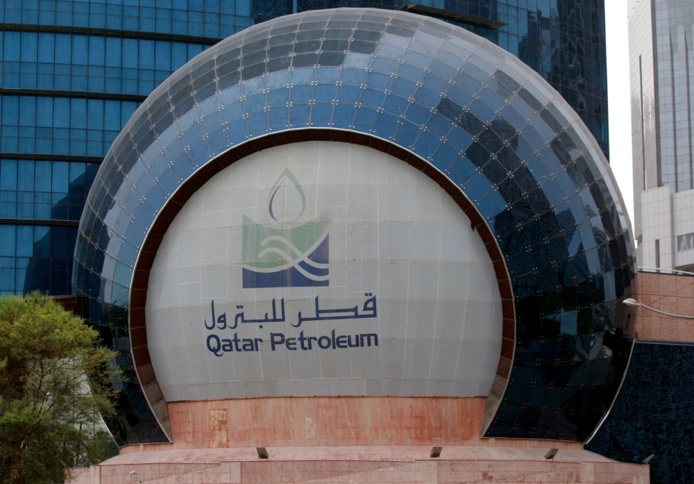 FILE PHOTO: The logo of Qatar Petroleum is seen at its headquartes in Doha, Qatar, July 8, 2017. REUTERS/Stringer/File Photo
