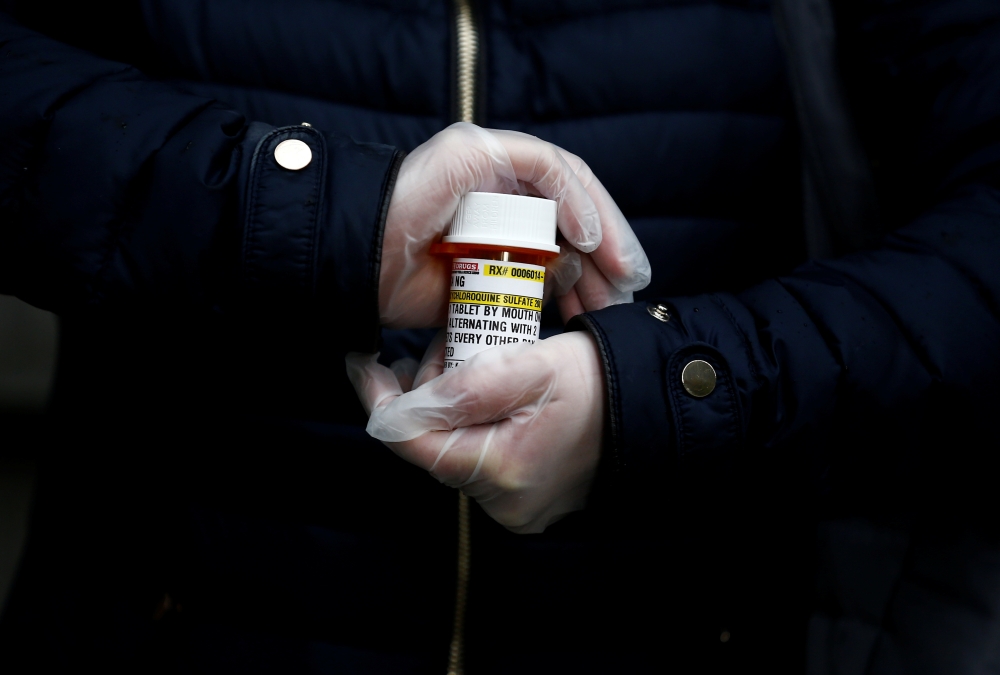 Laura Ng, who has lupus and had to recently call at least five pharmacies before she could find a place to fill her hydroxychloroquine prescription, is photographed in Seattle, Washington, U.S. March 31, 2020. Reuters/Lindsey Wasson