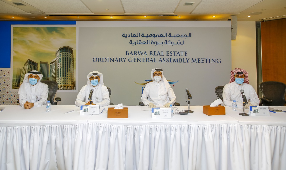 Barwa Real Estate Group Chairman H E Salah bin Ghanem Al Ali and other Board Members during the Ordinary General Assembly Meeting, yesterday.
