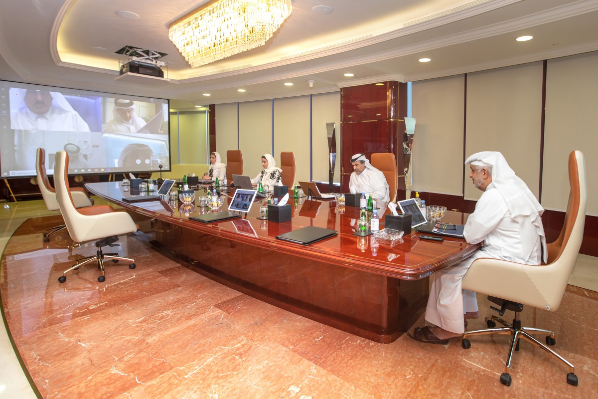 Turki bin Mohammed Al Khater (right), UDC Chairman, and other senior officials of the Company holding a meeting through the electronics communications, while maintaining the social distancing due to the COVID-19 pandemic, at the UDC headquarters in Doha, 