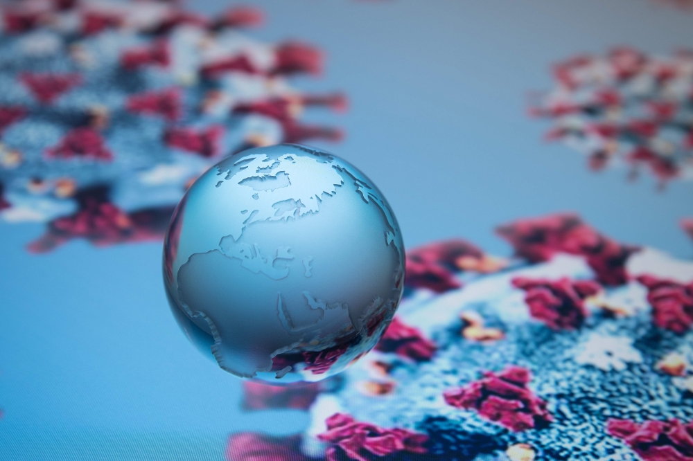 A globe showing Europe, Africa and Asia is pictured on an illustration representation of COVID-19, the disease caused by the novel coronavirus in Paris on April 24, 2020. AFP / JOEL SAGET