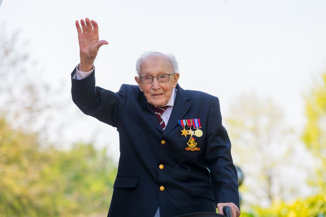 Capt. Tom Moore, a British war veteran who was then 99, reacts after completing the 100th length of his back garden in Marston Moretaine, Bedfordshire, Britain, on April 16. Vickie Flores/EPA-EFE/REX/Shutterstock.
