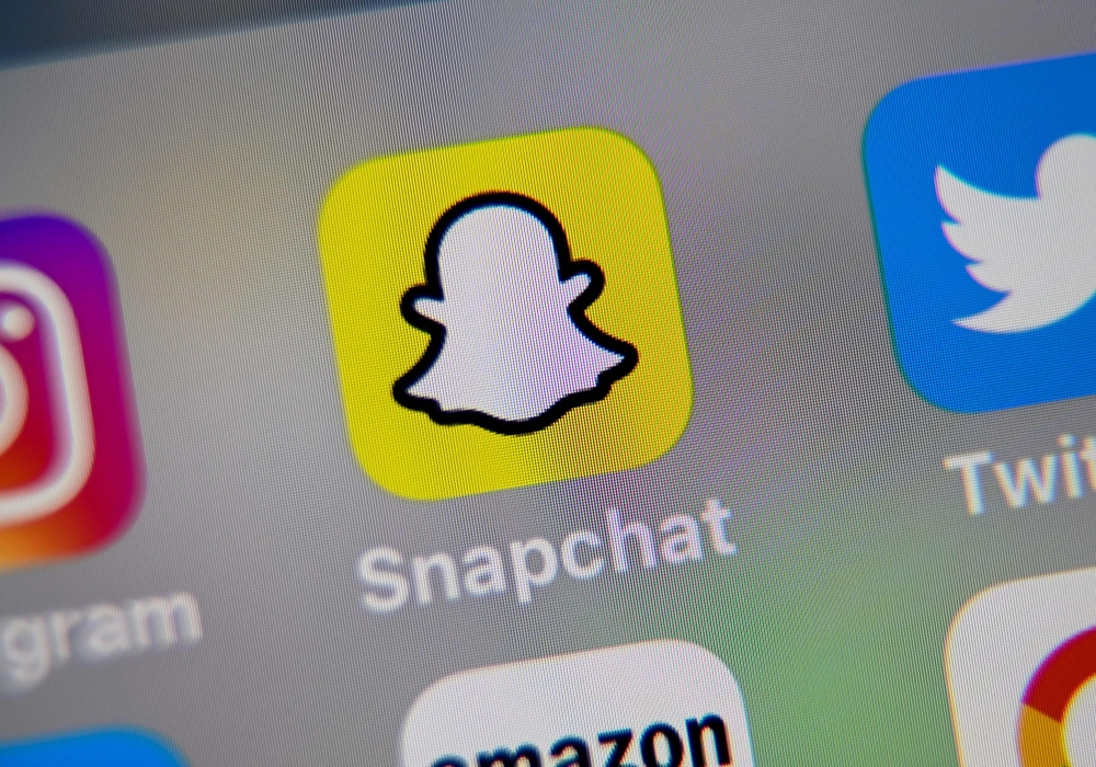  In this file photo illustration taken on October 01, 2019, in Lille, France, shows the logo of mobile app Snapchat displayed on a tablet. (AFP / DENIS CHARLET)