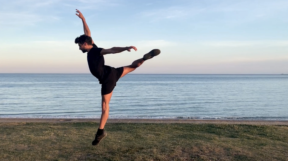 Royal Ballet dancer Nicol Edmonds performs at Marazion Beach, in Cornwall, Britain June 2020. Acting for Others/Joanna Defelice, Melanie Hamrick and Meaghan Grace Hinkis/Handout via Reuters