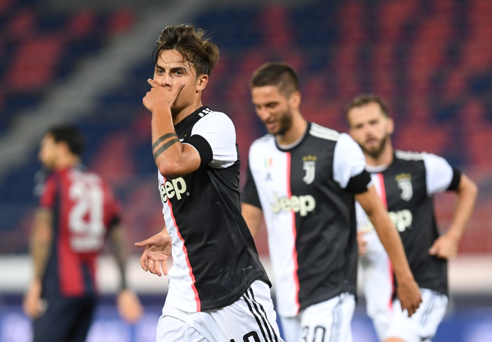 Juventus' Paulo Dybala celebrates scoring their second goal, as play resumes behind closed doors following the outbreak of the coronavirus disease (COVID-19) REUTERS/Jennifer Lorenzini